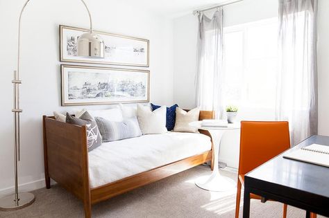 Transitional home office features a wood daybed and a round marble top table illuminated by a chrome arc floor lamp… Office With Daybed, Bedroom And Office Combo Ideas, Bedroom Office Combo, Guest Room Office Combo, Simple Bedroom Ideas, Orange Bedroom Ideas, Guest Bedroom Home Office, Home Office Guest Room Combo, Mirrored Bedroom