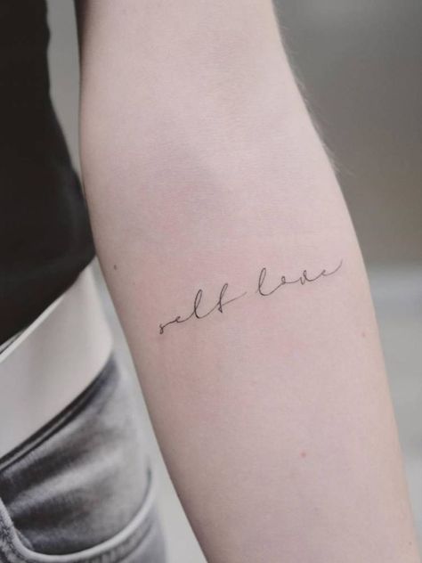 a beautiful cursive written tattoo, 'self love', on arm Fine Line Quotes, Best Small Tattoos For Women, Women Minimalist Tattoo, Tattoos For Women Minimalist, Wing Tattoos On Wrist, Self Love Tattoos, Best Small Tattoos, Strength Quote, Forearm Tattoo Quotes