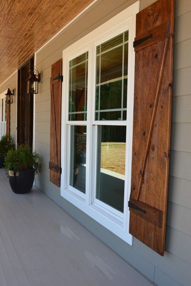 Front porch with custom ceiling, cedar posts, stone columns and wood shutters. Farmhouse Exterior Design, Farmhouse Front Porches, Shutters Exterior, Wood Shutters, Modern Farmhouse Exterior, Casa Exterior, Farmhouse Exterior, Exterior Home, Exterior Ideas