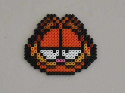 Garfield Perler by ShokoKito.deviantart.com Garfield Perler, Perler Projects, Hamma Beads Ideas, Pixel Beads, Melty Bead Patterns, Easy Perler Beads Ideas, Fusion Beads, Perler Bead Templates, Perler Crafts