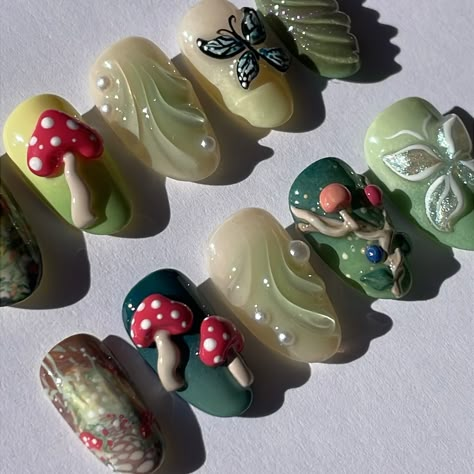 enchanted forest custom set 🍄🌳✨ vine nail ib @setsxnenita mushrooms ib @innerbloom.nails . . . #pressonnails #pressonnailbusiness #nailart #naildesign #3dnailart #handpaintednailart #enchantedforest #forestnails #naturenails #mushroomnails #butterflynails Mushroom Press On Nails, Pretty Press On Nails, Mossy Nails, Short Mushroom Nails, Whimsical Nail Designs, Forest Nails Designs, Forest Fairy Nails, Aesthetic Nails Spring, Spring Theme Nails