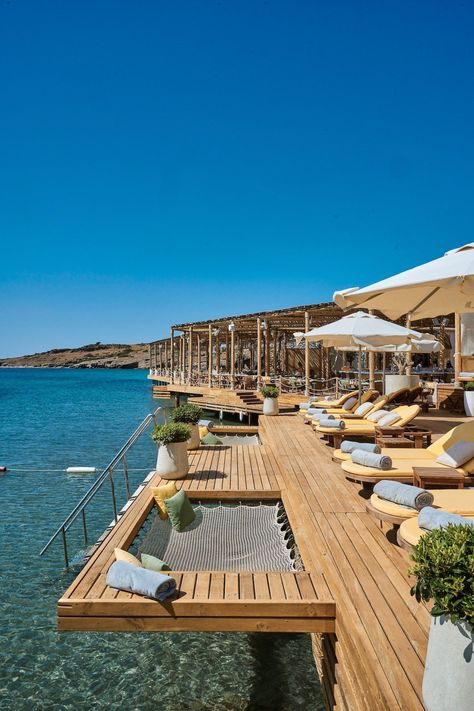 A chic beach getaway destination tucked away in a cove with views of Bodrum’s old town. The multi-room villas are perfect for groups of friends. The open-air deck at Folie Beach restaurant is a popular spot for soaking up the sun, too, and the over-water hammocks add an extra touch of luxury. #turkeyluxuryhotel #luxuryhotelsturkey #bodrumturkeyhotelluxury #bodrumhotelluxury #bodrumturkeybeach #bestresortsinbodrum #bestplacestostayinbodrum #turkeyluxurybeachresort Bodrum Restaurant, Beach Hotel Design, Luxury Vacation Spots, Bodrum Beach, Luxury Beach Vacation, Beach Dock, Turkey Beach, Luxurious Resort, Hotel Beach