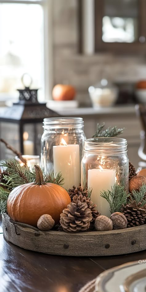 Cozy fall kitchen decor with a rustic tray featuring candles, pinecones, and a pumpkin, creating a warm and inviting autumn house decor atmosphere. Fall Decor With Mason Jars, Fall Kitchen Aesthetic, Candle On Table, Fall Decor For Kitchen, Rustic Thanksgiving Decor, Fall Interior Decor, Rustic Thanksgiving Decorations, Fall Tray Decor, Fall Table Decorations