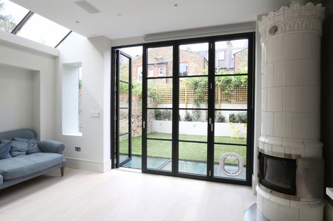 Incorporating a dog flap into these Sieger #bifold doors also gives the family dog easy access to the garden where they are able to run around freely. Bifold Doors Onto Patio, Crittall Doors, Crittal Doors, Steel Frame Doors, Steel Doors And Windows, Side Return, Modern Renovation, Folding Door, House Extension Design