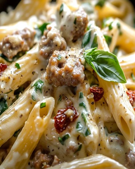 Make this easy Creamy Tuscan Sausage Pasta with rich flavors of sun-dried tomatoes, spinach, and Parmesan in just 30 minutes! Pasta With Italian Sausage And Spinach, Creamy Sausage And Spinach Pasta, Italian Sausage Alfredo Pasta, Tuscan Pasta Recipes, Tuscan Skillet, Creamy Tuscan Sausage Pasta, Tuscan Sausage Pasta, Sausage Pasta Recipes Easy, Creamy Tuscan Pasta