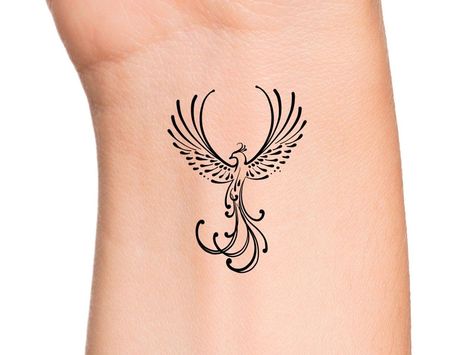 Ideas tattoo for woman Phinixbird Tattoo, Phoenix Minimalist Tattoo, Phoenix Wrist Tattoo, Phoenix Tattoo Minimalist, Tiny Phoenix Tattoo, Phoenix Rising From Ashes Tattoo Women, Fine Line Phoenix Tattoo, Minimalist Phoenix Tattoo, Simple Phoenix Tattoo