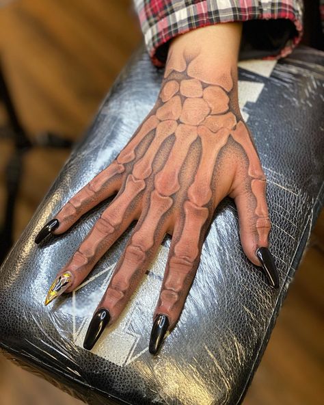 22 Amazing Skeleton Hand Tattoos That Are Scary and Attractive 14 Hand Tattoo Bones Skeleton, Skeleton Arm Sleeve Tattoo, Realistic Skeleton Hand Tattoo, Half Skeleton Hand Tattoo, Skeleton Neck Tattoo, Skeleton Arm Spine Tattoo, Hand Tattoo Easy, Scary Hand Tattoos, Hand Tattoos For Women Skeleton