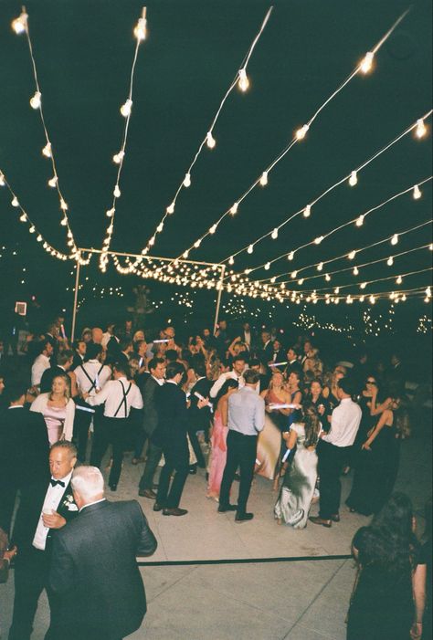 Wedding dance floors adorned with string lights create a magical and inviting atmosphere, perfect for celebrating under a soft, romantic glow. The twinkling lights suspended overhead add a whimsical touch, making the space feel intimate and enchanting. Combined with the lively energy of the dance floor, this setup brings warmth and elegance to any wedding reception. #WeddingDanceFloor #StringLightsMagic #RomanticWeddingVibes #EnchantedReception #WhimsicalWeddings #DanceUnderTheLights #MagicalWeddingNights #WeddingDecorGoals #TwinklingLights #ElegantWeddings Twinkle Lights Over Dance Floor, Outdoor Dancefloor, Wedding Dance Floors, Dancing Wedding, Wedding Dance Floor, Wedding Reception Lighting, Dance Floor Wedding, Dance Floors, Tent Lighting