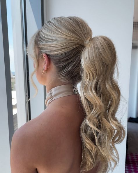 The ponytail is never not a good idea in my opinion 🤷🏼‍♀️⁣ ⁣ Loved that we kept this ponytail simple with some soft textured waves.⁣ ⁣ Her high neck dress, the ponytail - it was a moment🤌🏻⁣ ⁣ The perfect style for a bridesmaid - swipe to see the front because she is gorgeous and SAVE for your bridesmaid hair inspo! High Ponytail Hairstyles For Hoco, Hoco Hair Styles Ponytail, Long Hair Formal Ponytail, Cute Homecoming Ponytails, Teased Ponytail Bridesmaid, Voluminous Ponytail Bridesmaid, Pagent Hair Ponytail, Senior Hoco Hairstyles, High Pony For Bridesmaid