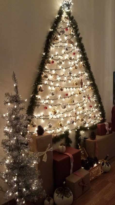 Christmas wall Tree Wall Lights Christmas Tree, Christmas Wall Trees, Xmas Tree On Wall With Lights, On The Wall Christmas Tree, Wall Tree Christmas Diy, Wall Light Christmas Tree, Christmas Wall Tree Ideas, Christmas Tree On Wall With Lights, Christmas Tree Ideas On The Wall