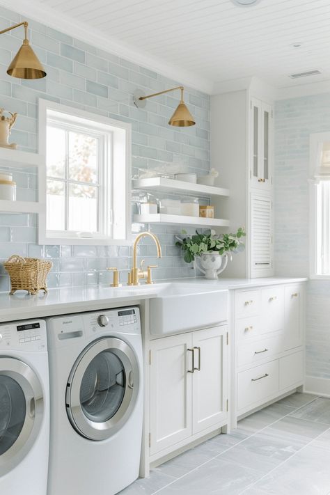 coastal laundry room with light blue subway tiles and white farmhouse sink Blue Backsplash Laundry Room, Cape Cod Beach House Interior Design, Classic Coastal Home, Coastal Style Laundry Room, Hamptons Style Laundry Room, Preppy Laundry Room, Tile For Laundry Room Wall, Light Blue House Decor, Laundry Room Ideas Blue