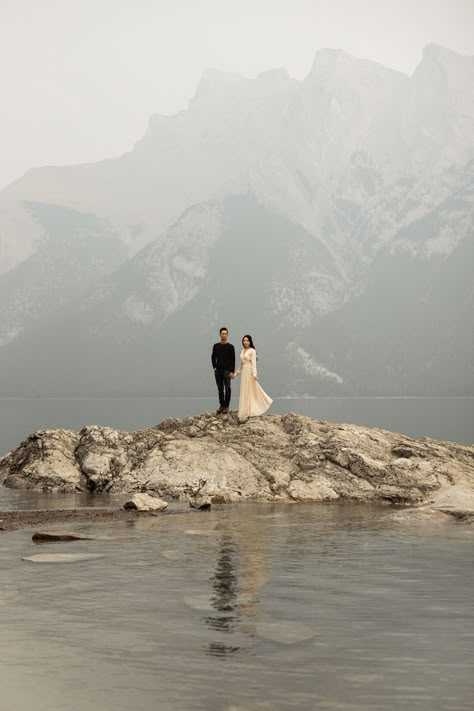 Banff engagement photos at Lake Minnewanka Engagement Photos Banff, Engagement Photo Lake, Lake Minnewanka Banff, Banff Engagement Photos, Bc Elopement, Nature Wedding Theme, Diy Budget Wedding, Banff Engagement, Pre Wedding Photoshoot Theme