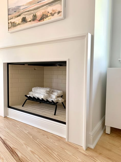 How We Built An Easy Modern Fireplace Mantel... Just In Time For Stockings! | Young House Love Fireplace Hearth Decor Modern, Simple Fireplace Tile, Contemporary Fireplace Surround, Small Diy Fireplace, Drywall Mantle, Modern Mantle Ideas, Mdf Fireplace Surround, Pole Wrap Fireplace, Boho Fireplace Ideas