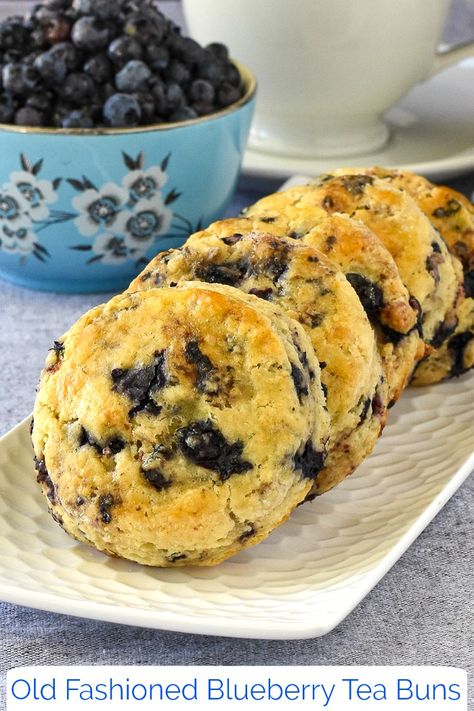 Blueberry Tea Buns. Serve them warm from the oven just as they are or drizzle on a simple vanilla glaze to fancy them up for teatime. #breakfast #brunch #weekendbrunch #sundaybrunch Tea Buns, Tea Buns Newfoundland Recipe, Blueberry Tea Buns, Blueberry Sweet Cream Buns, Blueberry Biscuits With Glaze, Newfoundland Tea Buns, Blueberry Tea Biscuits, Buttery Blueberry Scones With Lemon Glaze, Sour Cream Scones