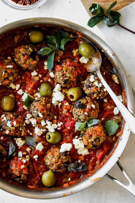 Vegetarian mushroom meatballs in a Spanish-inspired tomato sauce with olives, feta, and herbs—A hearty, nutritious dish that is ready for your weeknight dinner rotation. Guys. We’re putting the fun in fungi today. And delivering the most insanely flavorful tomato sauce for all of your pasta-adjacent needs. It gives anything jarred on the shelf a serious run...Read More » Meatball And Veggie Recipes, Mushroom And Feta Recipes, Vegetarian Greek Meatballs, Mushroom Balls, Vegetarian Meatballs Recipe, Vegan Meatballs Mushrooms, Vegan Balls Vegetarian Meatballs, Eggplant Mushroom Meatballs, Spanish Sauce