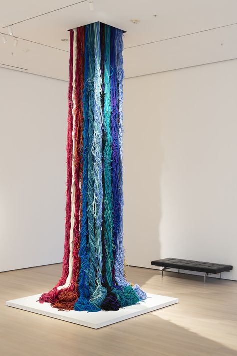 Sheila Hicks. Pillar of Inquiry/Supple Column. 2013–2014 “I want my work to hit the floor in a very emphatic way, so it...spills, puddles, and looks as though it's alive. It's moving and has its own internal energy” “In all of the cultures of the world, textile is a crucial and essential component…. There’s a level of familiarity that immediately breaks down any prejudice” “I think that is important, the wanting: the desire to hold it in your hands, to befriend it, to see if it bites, or if it’s Fabric Installation Art, Art With Yarn, Exhibition Design Ideas, What Is Contemporary Art, Encaustic Art Techniques, Sheila Hicks, Textiles Ideas, Fabric Installation, Art Alevel