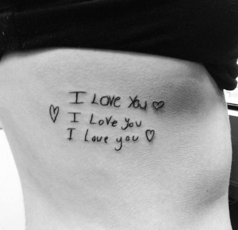 “I got this tattoo of my mom, dad, and brother's "I love you" they all wrote me in their handwriting on my ribs. They all mean so much to me, and I feel as though it was super important to me to get a piece of them somewhere close to my heart so I know they are always near no matter how far away.” – Mallory #pretty #tattoo #words Love You More Tattoo, Rib Tattoo Quotes, Handwriting Tattoos, Forearm Tattoo Quotes, Tattoo Words, Love Yourself Tattoo, Pretty Tattoo, Small Quote Tattoos, Kids Handwriting