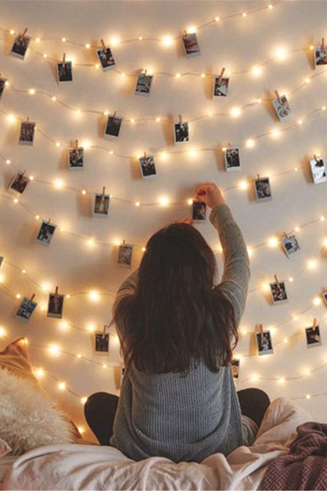 Create your own fairy tale picture wall art with these extraordinarily beautiful light strings. Use these pretty little lights with wooden pins, to create a romantic atmosphere to your bedroom, wedding, or for some other special, unforgettable moment. #bedroomdecor #teenroom #lights #photodisplay #fairylights #stringlights #weddingdecor Photo Walls Bedroom, Picture Wall Bedroom, Light Picture Wall, String Lights In The Bedroom, Fairy Lights Bedroom, Lights Bedroom, Outdoor Bedroom, Indoor String Lights