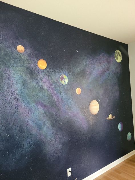 Created a galaxy wall for the kids bedroom by painting and blending and then finishing off with planet decals Diy Space Painting, Space Wall Painting Bedroom, Galaxy Wall Paint, Diy Space Mural, Wall Paint Patterns Bedroom Galaxy, Planet Mural, Planets Painted On Wall, Astronomy Room, Space Wall Painting