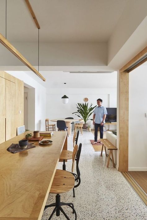 a modern dining room with a pretty black and white terrazzo floor, light stained furniture and a pendant lamp is a chic space Black And White Terrazzo Floor, Terrazzo Living Room, Terrazzo Flooring Living Room, 5 Room Hdb, White Terrazzo Floor, Terrazzo Interior, Terrazo Flooring, Terazzo Floor, Terrazzo Kitchen