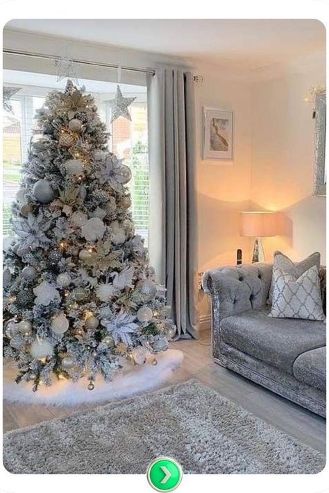 Frosted Christmas tree with silver accents for a winter wonderland vibe. Peaceful and serene, this setup brings a touch of frosty magic into your living room. Frosted Christmas Tree Decorations, Classy Christmas Decor, Frosted Christmas Tree, Tree Inspiration, Christmas Decor Inspiration, Classy Christmas, Christmas Tree Inspiration, Green Christmas Tree, Silver Accents