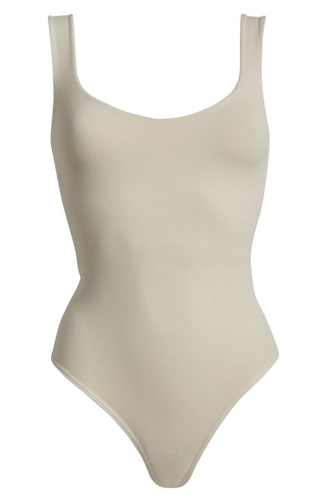 A sleek curve-hugging bodysuit featuring a dipped neckline and low U-back. Stretch fit Built-in shelf bra Snap gusset closure Thong cut 92% nylon, 8% elastane Machine wash, dry flat Imported Built In Shelves, Shelf Bra, Clean Lines, Nordstrom Rack, Free People, Nordstrom, Sleek, Bra, Free Shipping