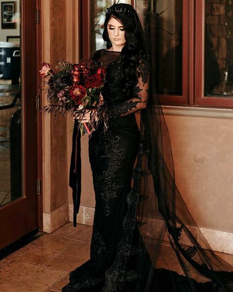 Since you are tired of traditional glamor, you can choose an extraordinary gothic style. Look at the best gothic wedding dresses. Black Wedding Dress White Tuxedo, Alt Wedding Dress Aesthetic, Black Wedding Dress With Veil, Morticia Addams Wedding Dress, Black Goth Wedding Dress, Black Wedding Reception Dress, Vintage Gothic Wedding Dress, Black Wedding Gowns Lace, Gothic Wedding Dress Victorian