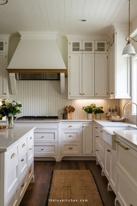 Spacious kitchen with white cabinetry, wooden accents, and a farmhouse sink. Kitchen Sink Facing Wall Ideas, Kitchen Sink Facing Wall, Bead Board Backsplash Kitchen Ideas, Beadboard Kitchen Walls, White Kitchen Wall Decor, Kitchen Remodel White Cabinets, White Beadboard Kitchen, Beadboard Backsplash Kitchen, Kitchen Countertops With White Cabinets