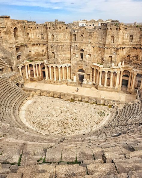 The Ancient Roman theatre in Bosra - Syria. It was built with black basalt during the second century AD.  The theatre is 102 meters and has room for about 15,000 people. It is therefore among the largest and best-preservedof the Ancient Roman civilization.  During the Syrian Civil War, the theatre was not much destroyed, apart from some sniper bullets and a couple of columns a bit damaged.  #syria #travelphoto #architecture #photos #archaeology #peace #roman #black - Give like and click save on Bosra Syria, Syria Country, Roman Theatre, Black Basalt, Film Genres, The Theatre, Ancient Romans, Syria, Archaeology