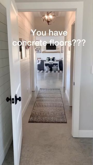 Cathy-Barndo living/decor on Instagram: "My most loved (and hated😂) reel of 2022. Still loving our concrete floors!!! 🙌🙌🙌 For all the concrete floor naysayers…we figured if we didn’t like our floors in the future, we would cover them. We are both in our 60s and haven’t had any problems with concrete floors. 2 years and 9 months…still going strong and STILL love them! . . . . . . . . . . . . #homeswithpurpose #barndominiums #concretefloors #woodmantle #shiplapfireplace #simplefarmhousetouches Concrete Floor Apartment Decor, Laundry Room Concrete Floor, Matte Concrete Floors In House, Concrete Floors In Bathroom, Concrete Flooring In Bathroom, Homes With Cement Floors, Barndo Concrete Floor, Bedroom With Concrete Floors, Farmhouse Concrete Floors