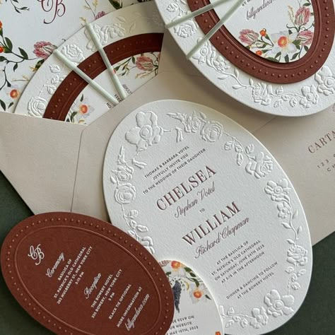 CARTA PLENA DESIGN / CAMILA DIAS on Instagram: "Chelsea & Billy’s invitation was likely the most classic & romantic design we have ever created, and we’re here for it! -  The design was built upon the concept “Vintage European Meets New York Chic,” where the fusion of styles, colors, and textures work together to convey an intimate, warm, and dreamy experience ( partly already seen in their Save the Date design). — The formal invitation is constructed in oval layers with contrasting tones with a subtle decadence touch. The typography brings modern romance to the composition with fonts that are both feminine & masculine, tying in a seamless conversation between the couple’s storyline, the venue, and their wedding day.  — The sculpted embossing borders, velvet ribbons, and custom-painted flo Gates Paper Co, Oval Wedding Invitation, Save The Date Vintage, Embossed Invitations, Embossed Wedding Invitations, Confetti Ideas, New York Chic, Save The Date Design, Deco Wedding Invitations