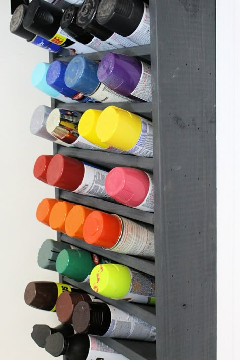 We had a bunch of spray paint cans in our garage and needed a good place to store them. So I built this awesome wall mounted paint can holder. It can hold up to 50 cans, which should be great for most workshops. #paint #garage #organize #diy #workshop #make #build Spray Paint Holder, Paint Storage Diy, Spray Paint Storage, Organize Garage Diy, Garage Organization Shelves, Paint Holder, Organize Garage, Storage Furniture Design, Shelves Garage