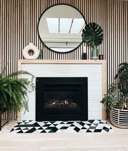 19 Fireplace Accent Wall Ideas to Enhance Your Room's Best Feature Slat Wall With Fireplace, Northwest Interior Design, Midcentury Modern Fireplace, Black Fireplace Surround, Wall With Fireplace, Pallet Shelving, Fireplace Accent Walls, Stone Fireplace Wall, White Built Ins