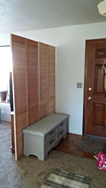 How to build a fake entryway foyer with window shutters How To Create A Fake Entryway, Fake Foyer Entryway, How To Fake Entryway, Fake Entryway Small Spaces, Entryway Privacy Ideas, How To Fake An Entryway When You Dont Have One, Faux Entryway Ideas, Fake Entryway Ideas, Fake Entryway