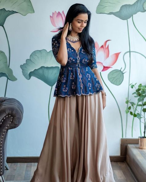 IssaStudio by Chetana & Swathi on Instagram: “Issa has launched its new collection. Presenting you: Aquamani peplum top with champagne Silk palazzo @issadesignerstudio Jewellery:…” Silk Crop Top And Skirt Indian, Peplum Top Outfits Indian, Crop Top And Skirt Indian, Peplum Top With Skirt, Crop Top Outfits Indian, Peplum Top Outfits, Western Couture, Short Kurti Designs, Indo Western Dresses For Women