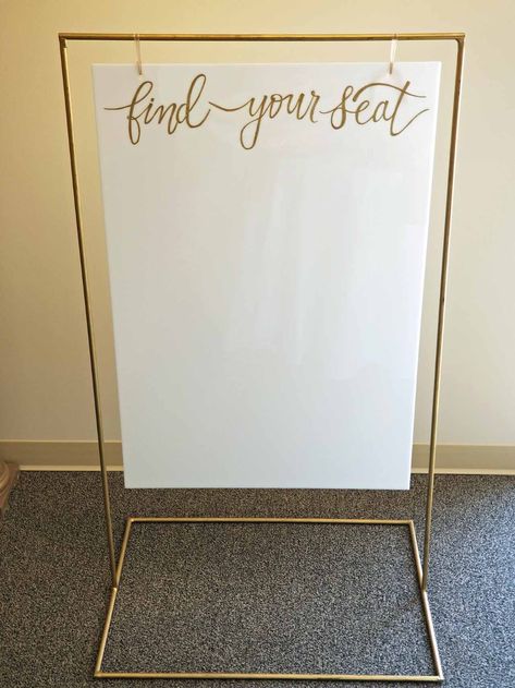 Gold Metal Sign Stand | Elite Events Rental Acrylic Sign Holder Diy, Diy Hanging Sign Stand, Sign Holder Stand Diy, Diy Sign Stand, Wedding Sign Holder, Wedding Table Assignments, Gold Hangers, Make Your Own Sign, A Frame Signs