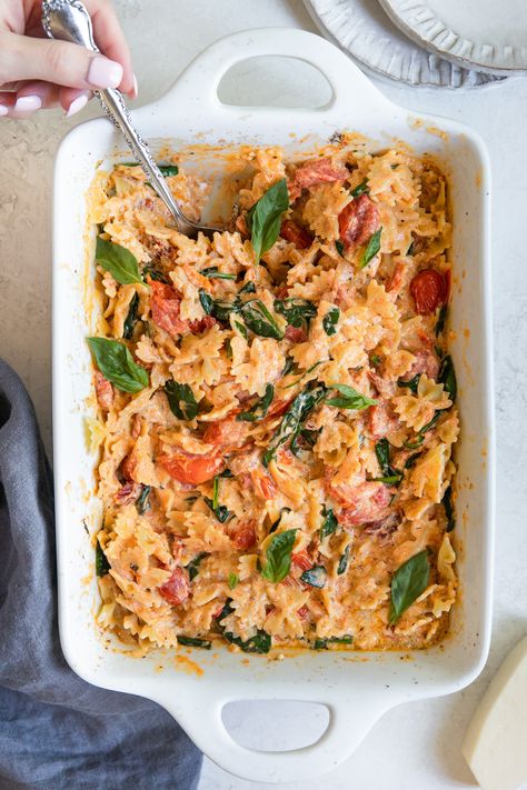 This Cream Cheese Pasta Bake is a simple recipe made by oven roasting a block of cream cheese with cherry tomatoes and a few other basic ingredients to create a creamy, flavorful sauce. #comfortfood #pasta #familydinneridea #dinnersforkids #tiktokpasta #creamcheesepasta #dinner #dinnerideas #creamcheesepastabake White Sauce Pasta Bake Recipes, Pasta Bake Recipes With Cream Cheese, Baked Tuscan Pasta, Vegetarian Recipes With Cream Cheese, Tomato Cheese Pasta Bake, Tomato And Cream Cheese Pasta, Easy Oven Pasta Recipes, Cream Cheese And Tomato Pasta, Cream Cheese Tomato Pasta Bake