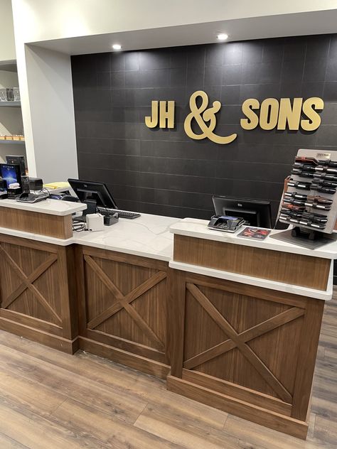 A new men's clothing store opened in spring 2022 in Omaha.  Our guys built and installed a retail store millwork package and commercial signage for J.H. & Sons Clothiers at One Pacific Place.  It's beautiful! This retail store project included the cash wrap desk & back wall, jeans wall, hanging displays, column wraps, ceiling cloud, dressing room mirrors, rotating tie and belt racks, as well as hanging suit bunkers. #teamcreative #cashwrap #exteriorsign #interiorsign #msiquartz #retaild Cash Counter Back Wall Designs, Desk Art Ideas, Retail Sales Counter, Cash Wrap Counter, Column Wraps, Commercial Signage, Cash Counter, Cash Wrap, Room Mirrors