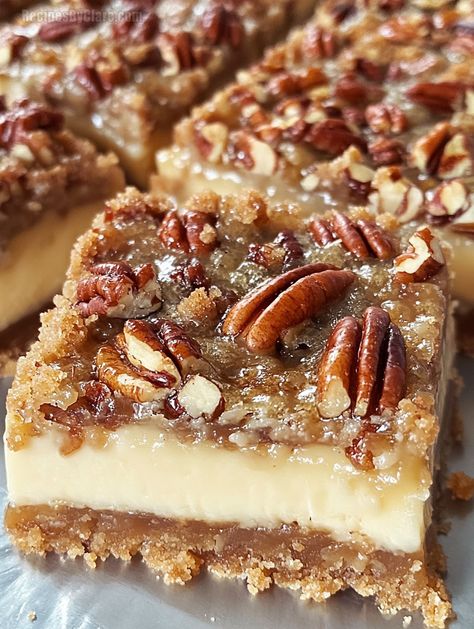 These Pecan Pie Cheesecake Bars combine a buttery graham crust, creamy cheesecake, and a sweet pecan topping for a delightful dessert. Pecan Cheesecake Crust, Easy Pie Dessert Recipes, Pecan Pie Slab Bars, Pecan Sandies Crust Dessert Recipes, Cheesecake Pecan Pie Bars, Thanksgiving Recipes For Dessert, Pecan Cream Cheese Bars, Pecan Pie Cream Cheese Bars, Cheesecake With Pecan Pie Topping