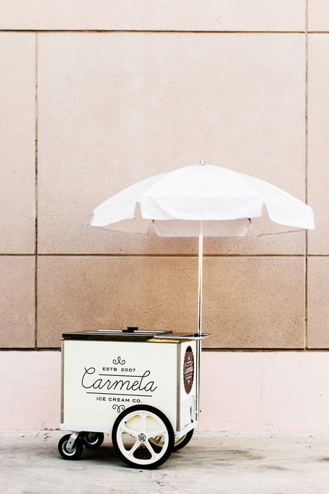 Carmela Ice Cream operates this umbrellaed push cart in Pasadena, California, as well as a larger ice cream truck and three retail locations in the great Los Angeles area. Their custard-style bases and fresh, seasonal ingredients result in delicious flavors like candied pecan, rosemary with toasted pine nuts, lemon verbena vanilla bean. They've got sorbets and sherbets, too. Prosecco Van, Gerobak Dorong, Food Truck Wedding, Pizza Truck, Mobile Bars, Push Cart, Ice Cream Stand, Mobile Food Trucks, Food Cart Design