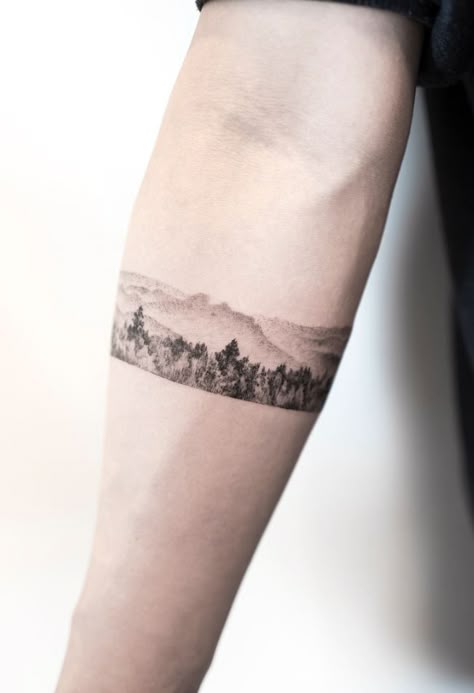 92 Lovely Tattoos by Hongdam - TheTatt New Love Tattoo, Landscape Armband Tattoo, Landscape Band Tattoo, Nature Armband Tattoo Design, Mountain Band Tattoo, Camp Tattoo, Hongdam Tattoo, Field Tattoo, Horizontal Tattoo