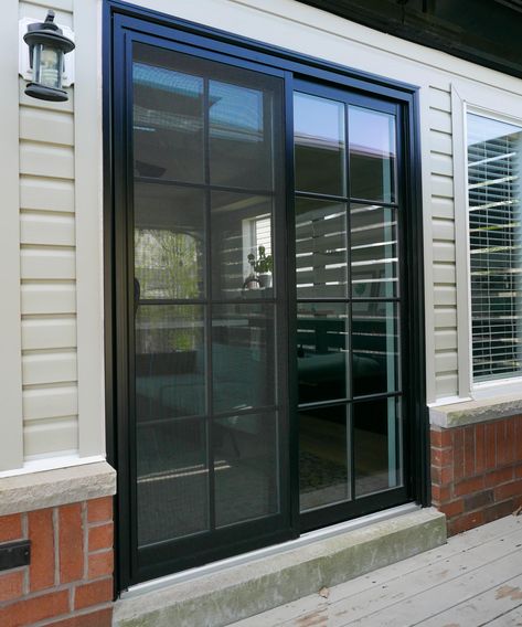 Level up up your backyard with a black double sliding patio door with SDL grilles. Let us help you with your next backyard project. Contact us today for all your patio door needs and questions. Black Sliding Doors Exterior, Black Sliding Doors Patio, Black Patio Doors, Black Sliding Doors, Double Sliding Patio Doors, Exterior Sliding Glass Doors, Black Sliding Door, Backyard Door, Pintu Ganda