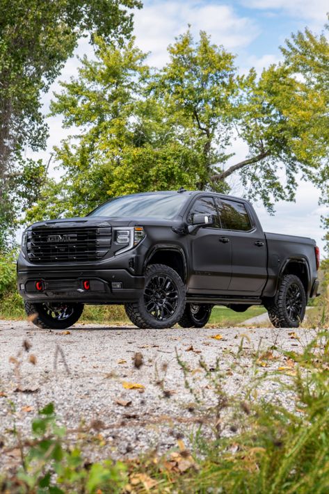 Full view of a 2024 GMC Sierra Denali truck with chrome delete trim, a satin black vinyl wrap, and a lift kit. Gmc Sierra Blacked Out, Blacked Out Gmc Sierra, Gmc Sierra Denali Lifted, Black Gmc Truck, Lifted Gmc Sierra 1500, Gmc Sierra Lifted, Gmc Truck Accessories, Gmc Denali Truck, Gmc Car