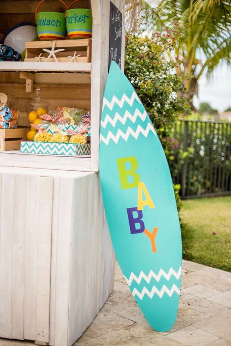 A Baby On Board - A Surfboard! | CatchMyParty.com Surfboard Baby Shower Ideas, Luau Baby Shower Ideas Boys, Surf Theme Baby Shower Boy, Baby On Board Baby Shower Ideas, Beach Theme Baby Shower, Surfer Baby Shower, Hawaiian Baby Shower, Hawaiian Baby Showers, Boy Shower Themes