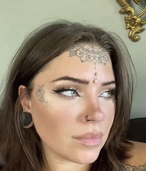 Women Forehead Tattoo, Dermal Piercing Forehead, Forehead Hairline Tattoo, Forehead Tattoo Woman Hairline, Forehead Dermal Piercing, Cheekbone Tattoo, Woman’s Face Tattoo, Forehead Dermal, Forehead Tattoo Woman