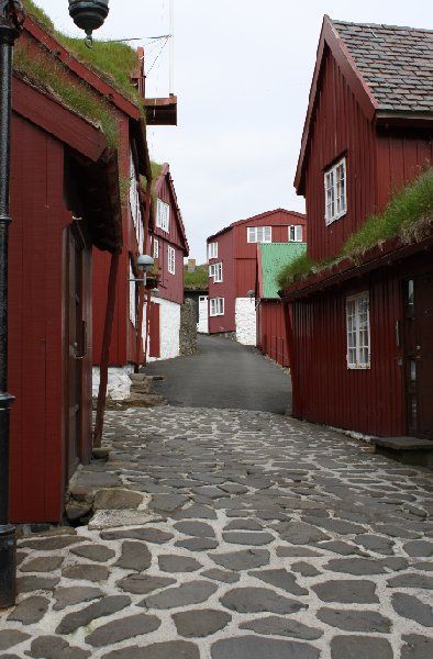 Narrow street in the village of Saksun, Faroe Islands. Faroe Islands Travel, Faroe Islands Denmark, Faroe Island, Dark River, Kingdom Of Denmark, Narrow Street, Scandinavian Architecture, Europe Photos, Nordic Countries