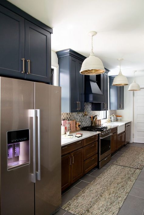 I thought I would go with all navy blue cabinets, but I realized that with the slate-tile we were using, I needed to add some warmth to this space. So I went with a two-tone look: warm wood lowers and dark blue uppers…and I absolutely love the outcome! Black And Wood Kitchen Ideas, Bronze Appliances, Kitchen Bump Out, Black And Wood Kitchen, Kitchen Diy Decor, Navy Blue Cabinets, Miranda House, Wood Kitchen Ideas, Neoclassical Home