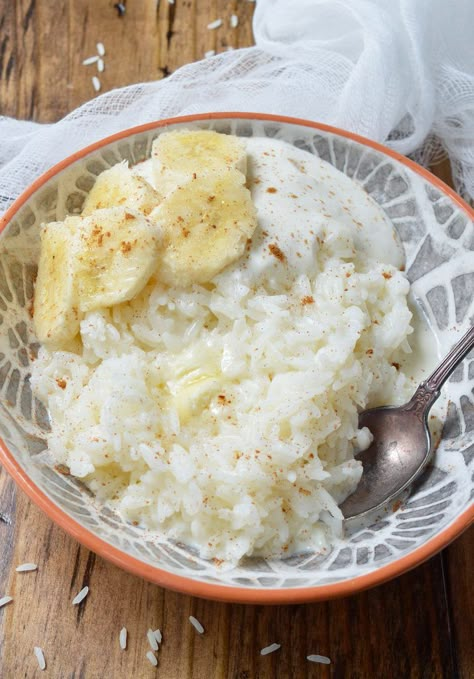 This 5 Ingredient Breakfast Rice Recipe is a dish from my childhood. Not only is it quick and easy but a 3rd grader can make it. . . I did. Sweet white rice swimming in milk and butter with a sprinkle of cinnamon. Top this comforting breakfast bowl with you favorite fruit, nuts or yogurt. Breakfast Rice Recipes, Breakfast With Rice, 5 Ingredient Breakfast, Rice Breakfast Recipes, Yogurt Rice, Comforting Breakfast, Rice Breakfast, Banana And Rice, Breakfast Rice