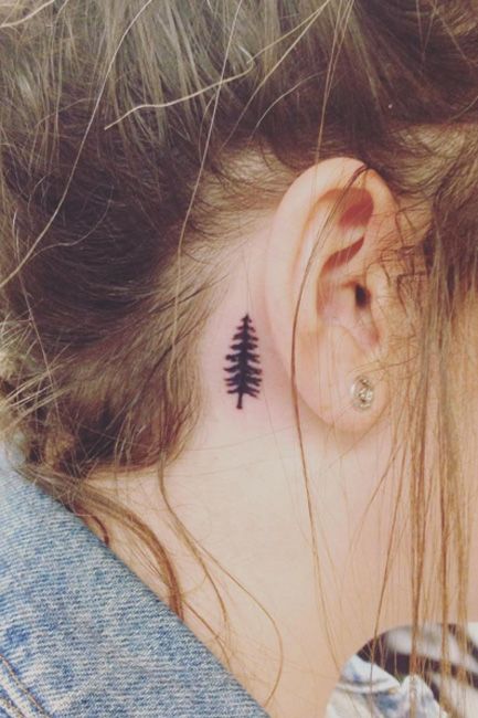 Tiny tattoo enthusiasts, this one's for you. Tree Tattoo Behind Ear, Small Tree Tattoo, Tattoos Masculinas, Ear Ideas, Small Tattoo Placement, Tattoo Behind Ear, Tattoo Placements, Petit Tattoo, Small Quote Tattoos