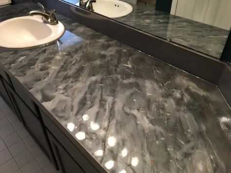 gray epoxy bathroom countertops with swirl pattern look sleek and glossy Bathroom Epoxy Countertop, Epoxy Bathroom Counter, Epoxy Countertop Bathroom, Epoxy Bathroom Countertop, Resin Bathroom Countertop, Epoxy Countertops Kitchen, Epoxy Countertops Diy, Soapstone Bathroom, Epoxy Kitchen Countertops